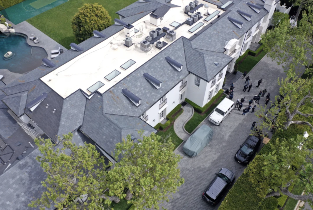 In an aerial view, the home of Sean "Diddy" Combs is seen during a raid by federal law enforcement agents in Los Angeles, California, on March 25