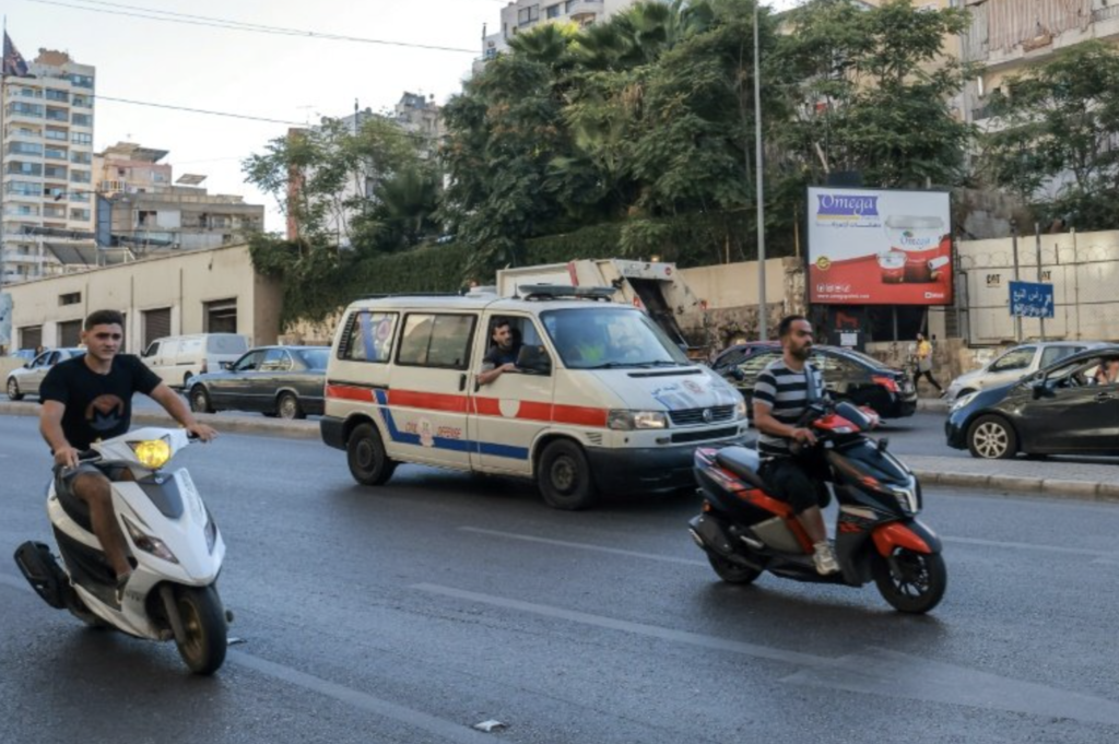 A Lebanese Red Cross ambulance rushes wounded people to hospital in Beirut after explosions hit Hezbollah strongholds around the country / © AFP